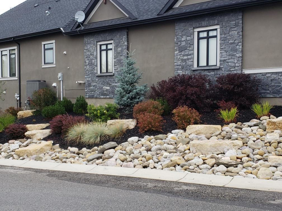 This is an example of a small transitional side yard xeriscape in Calgary.