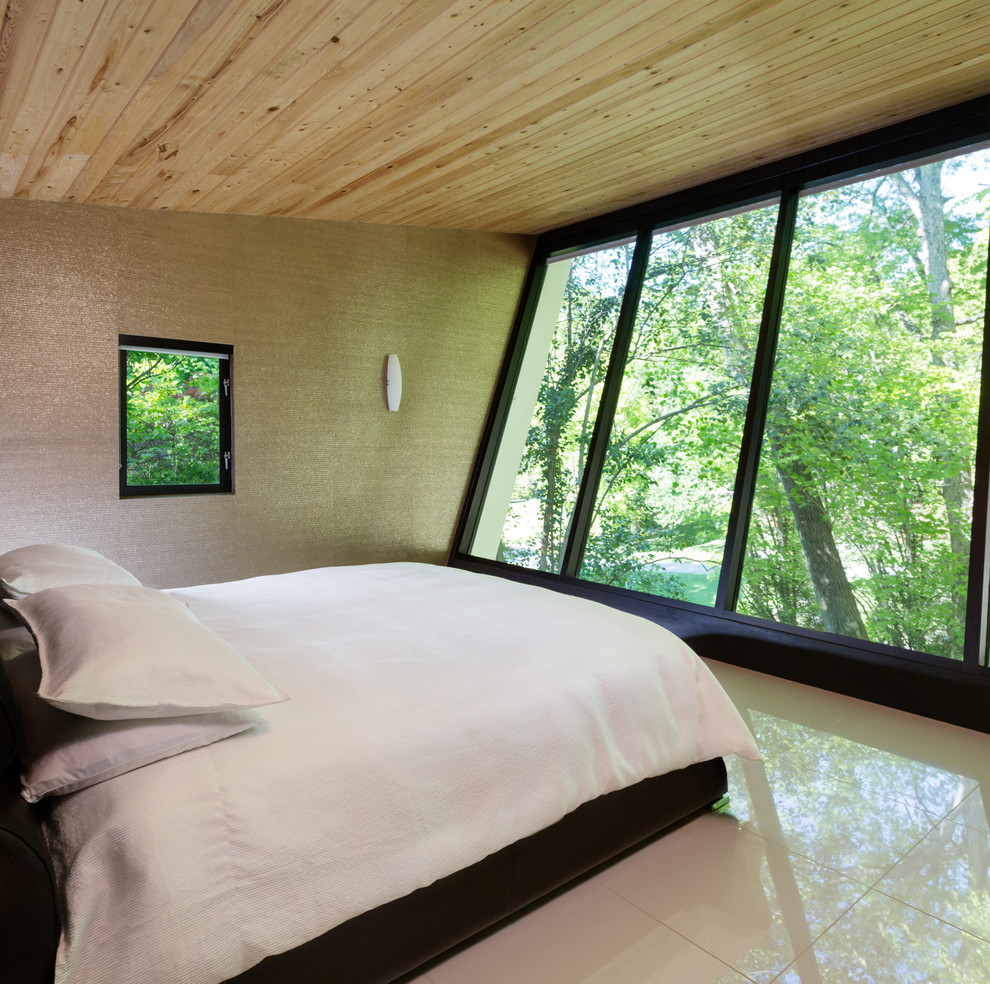 Contemporary bedroom in Atlanta with beige walls.