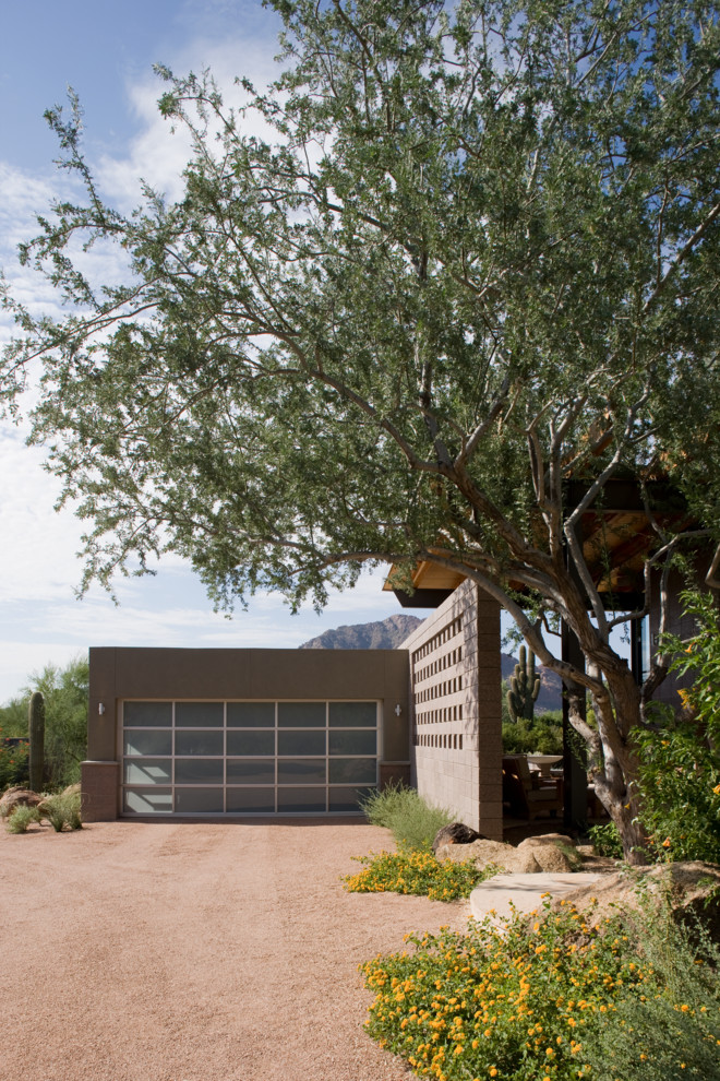 This is an example of a contemporary detached garage in Phoenix.