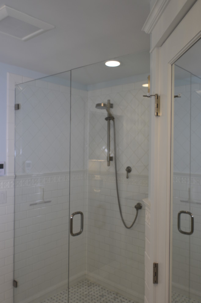 Inspiration for a mid-sized traditional master bathroom in Seattle with shaker cabinets, white cabinets, a double shower, white tile, subway tile, blue walls, marble floors, an undermount sink and marble benchtops.