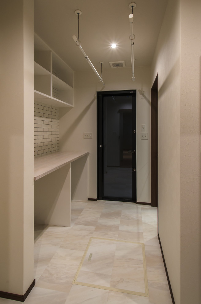 This is an example of a medium sized world-inspired utility room in Sapporo.