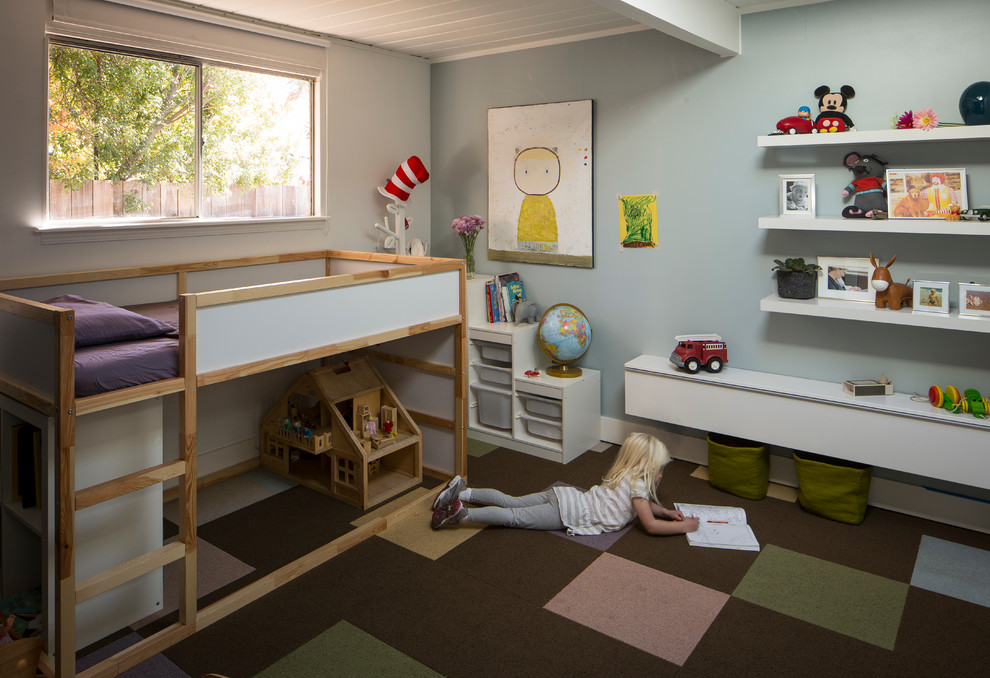 Design ideas for a mid-sized midcentury gender-neutral kids' bedroom for kids 4-10 years old in San Francisco with grey walls, carpet, multi-coloured floor and exposed beam.