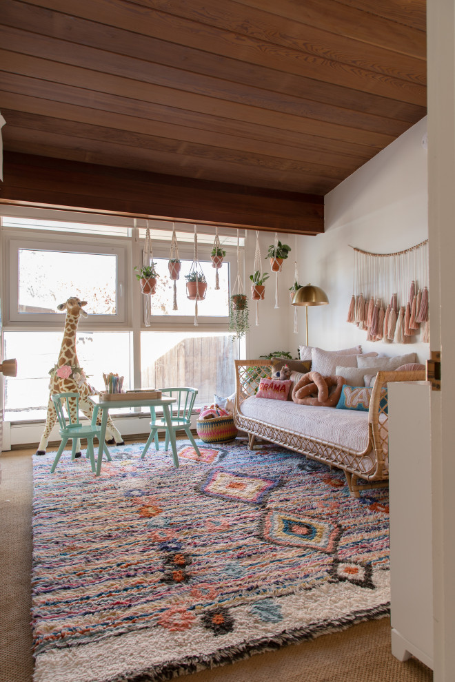 This is an example of a retro kids' bedroom for girls in Los Angeles with white walls, carpet, brown floors, a vaulted ceiling and a wood ceiling.