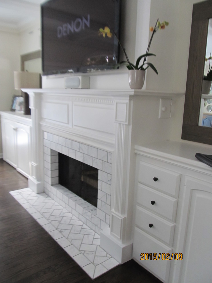 Photo of a large contemporary family room in Milwaukee with white walls, dark hardwood floors, a standard fireplace, a tile fireplace surround and a wall-mounted tv.