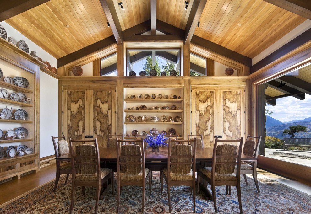Inspiration for a mid-sized country separate dining room in New York with white walls and dark hardwood floors.