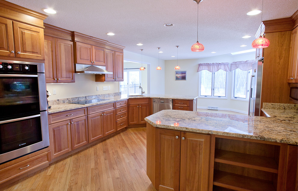 Inspiration for a large transitional kitchen remodel in Bridgeport with an undermount sink, raised-panel cabinets, granite countertops, stainless steel appliances and no island