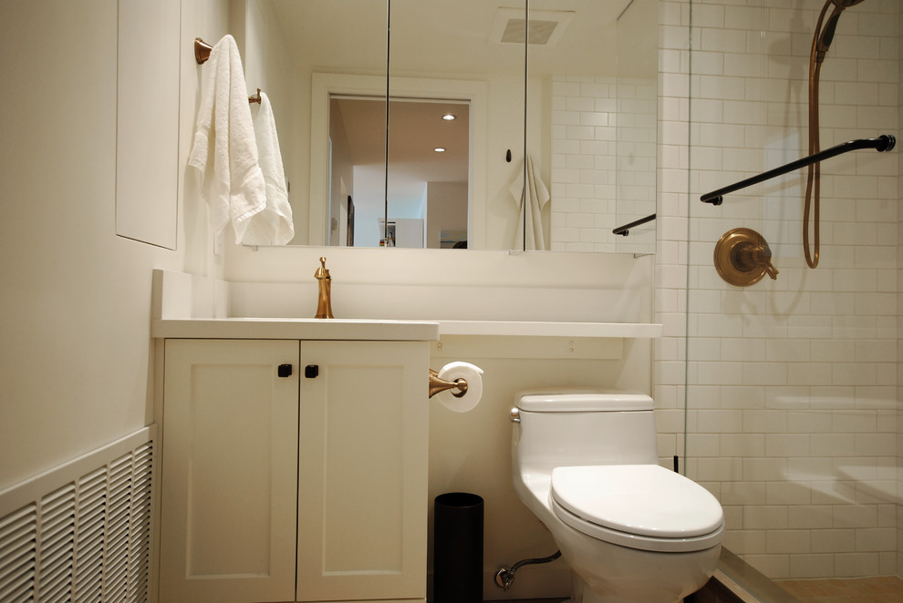 This is an example of a small contemporary master bathroom in Vancouver with an undermount sink, shaker cabinets, white cabinets, engineered quartz benchtops, an open shower, a two-piece toilet, white tile, ceramic tile, white walls and porcelain floors.