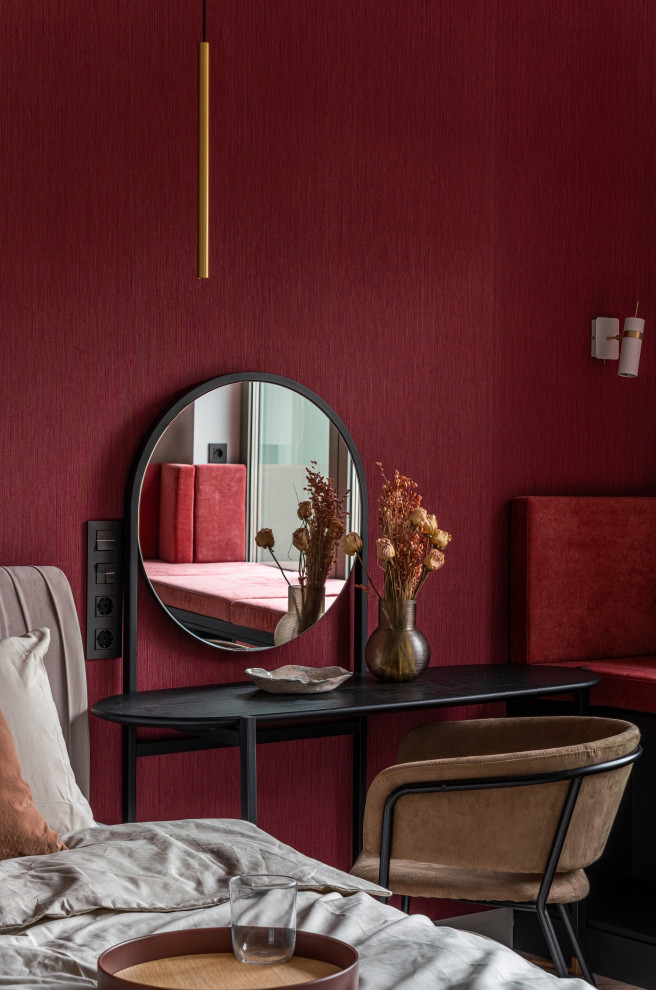 Mid-sized contemporary bedroom in Saint Petersburg with red walls, medium hardwood floors, beige floor and wallpaper.