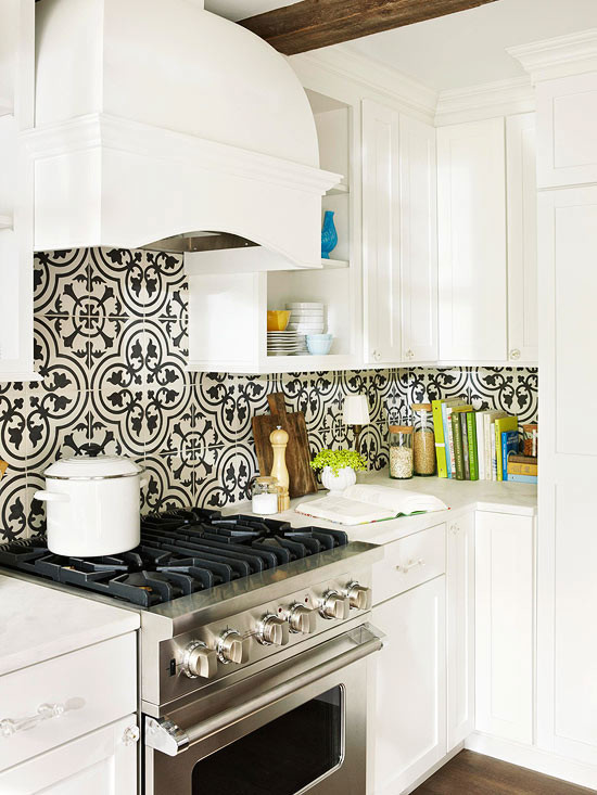 This is an example of a country kitchen in Los Angeles with recessed-panel cabinets and cement tile splashback.