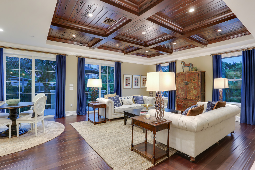 Inspiration for a large traditional formal enclosed living room in Tampa with beige walls, dark hardwood floors, no fireplace, no tv and brown floor.