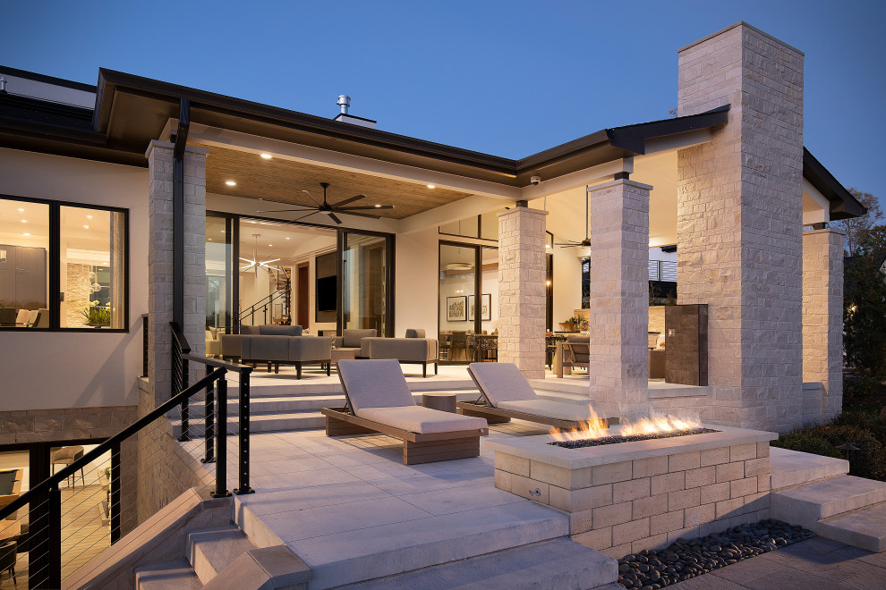 Patio - huge contemporary backyard concrete patio idea in Nashville with a fireplace and no cover