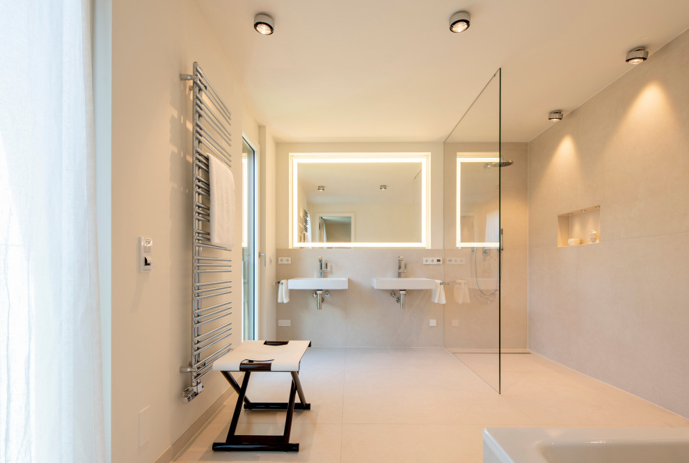 Design ideas for a large contemporary master bathroom in Munich with glass-front cabinets, white cabinets, a curbless shower, white tile and a double vanity.