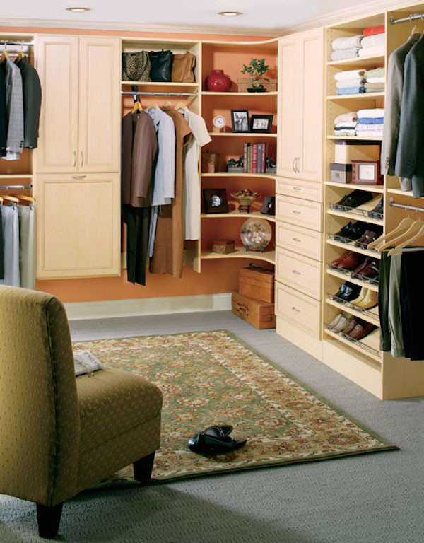 Photo of an arts and crafts gender-neutral walk-in wardrobe in Other with louvered cabinets, light wood cabinets and carpet.