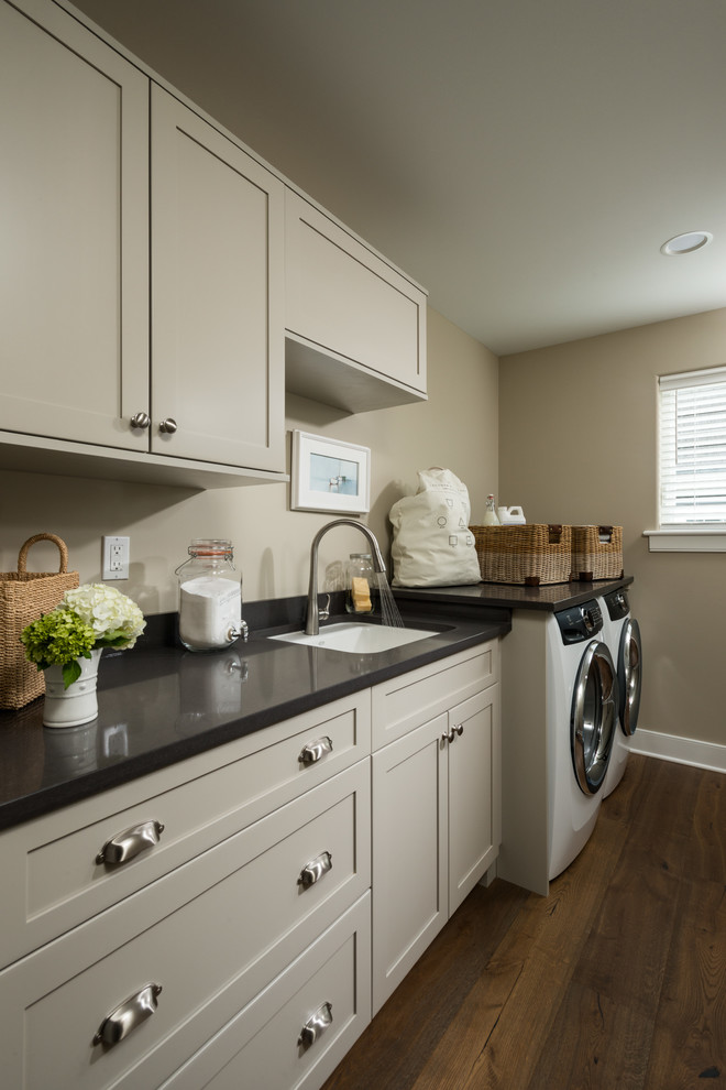 Design ideas for a transitional laundry room in Boston.