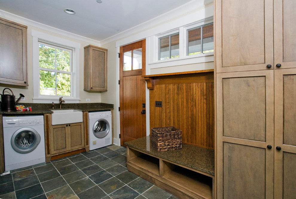 Arts and crafts laundry room in Chicago with a farmhouse sink and slate floors.