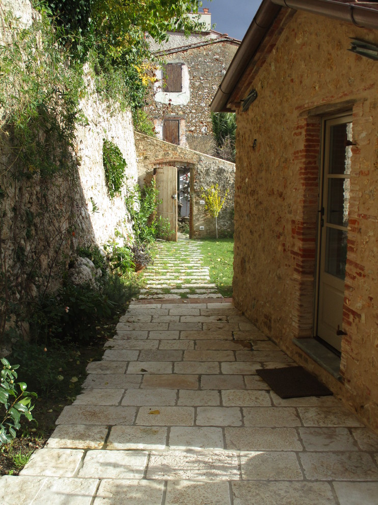 Example of a tuscan home design design in Other