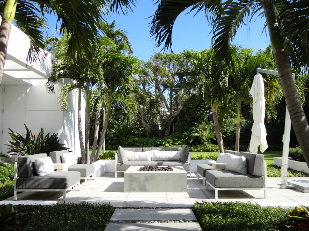 Inspiration for a contemporary backyard patio in Miami with no cover.