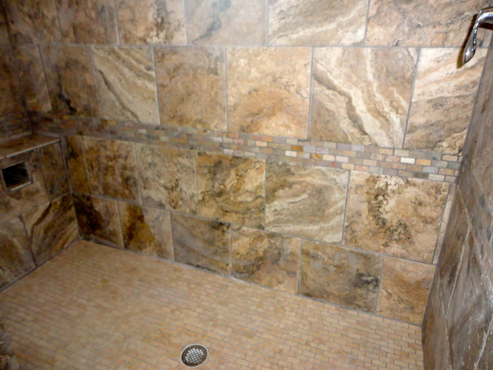 Photo of a large master bathroom in Albuquerque with a curbless shower, multi-coloured tile, ceramic tile and ceramic floors.