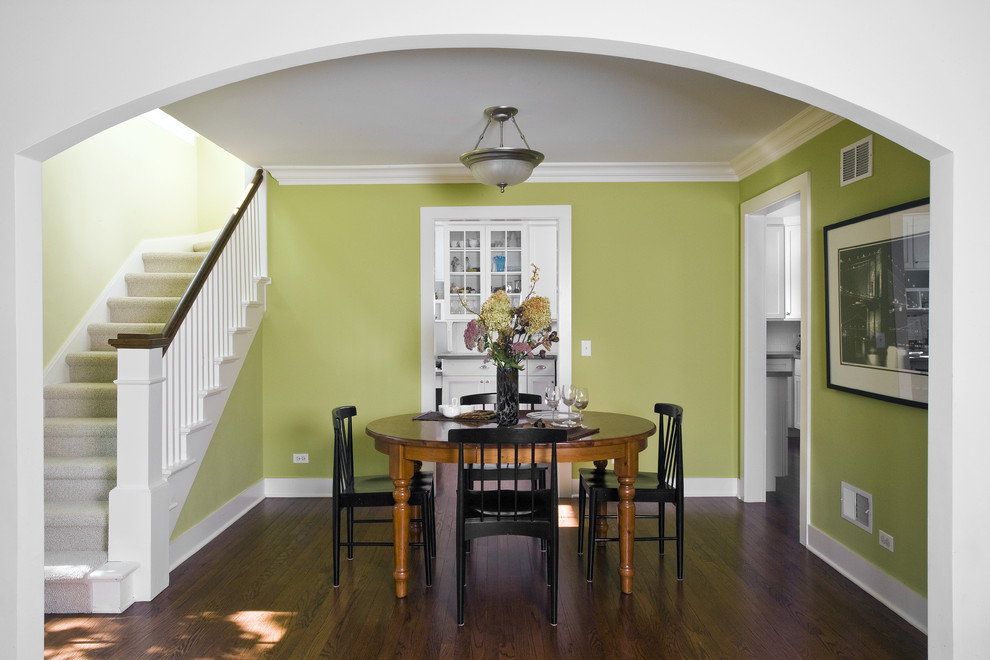 Photo of a mid-sized traditional open plan dining in Chicago with green walls, medium hardwood floors and brown floor.