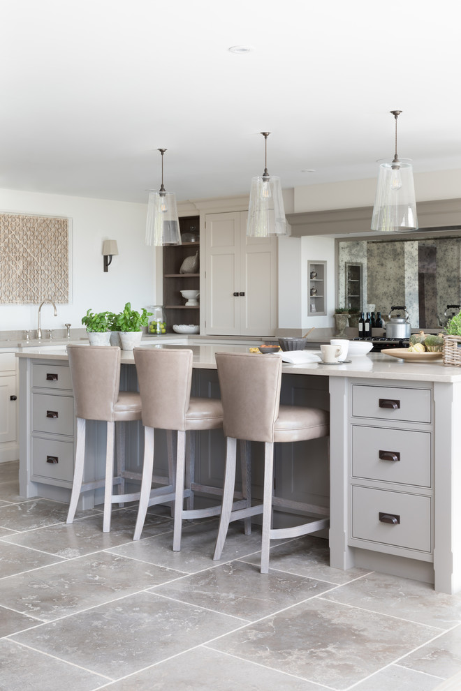 This is an example of a large transitional kitchen in Sussex.