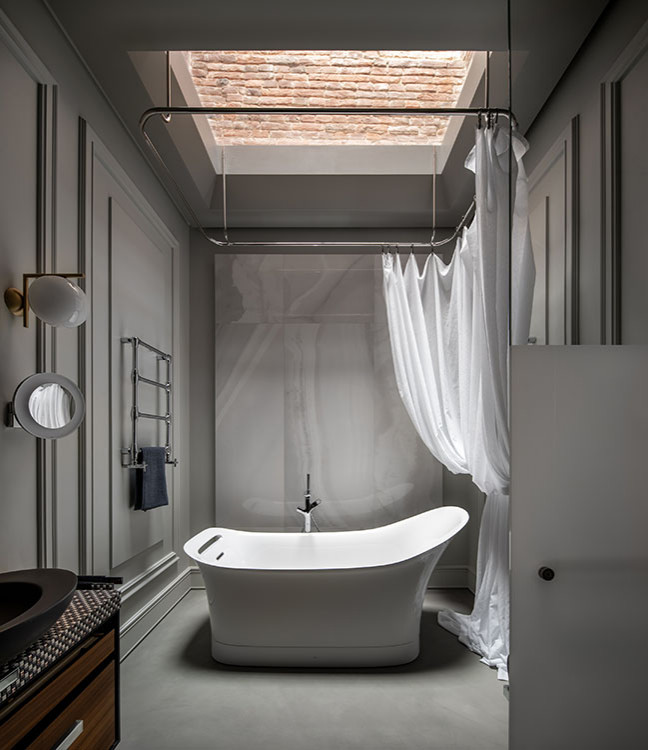 Inspiration for a large traditional bathroom in Sydney with white walls, medium hardwood floors, multi-coloured floor, vaulted and panelled walls.