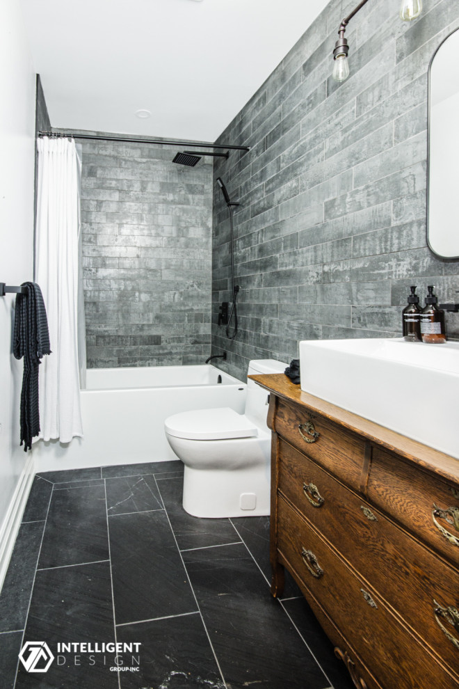 Inspiration for a mid-sized scandinavian 3/4 gray tile and porcelain tile slate floor, black floor and single-sink bathroom remodel in Toronto with furniture-like cabinets, medium tone wood cabinets, a one-piece toilet, white walls, a vessel sink, wood countertops, brown countertops and a freestanding vanity