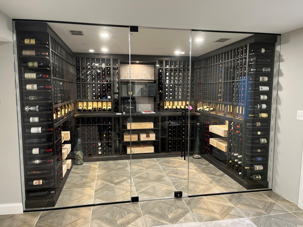 Mid-sized transitional wine cellar in DC Metro with porcelain floors and beige floor.