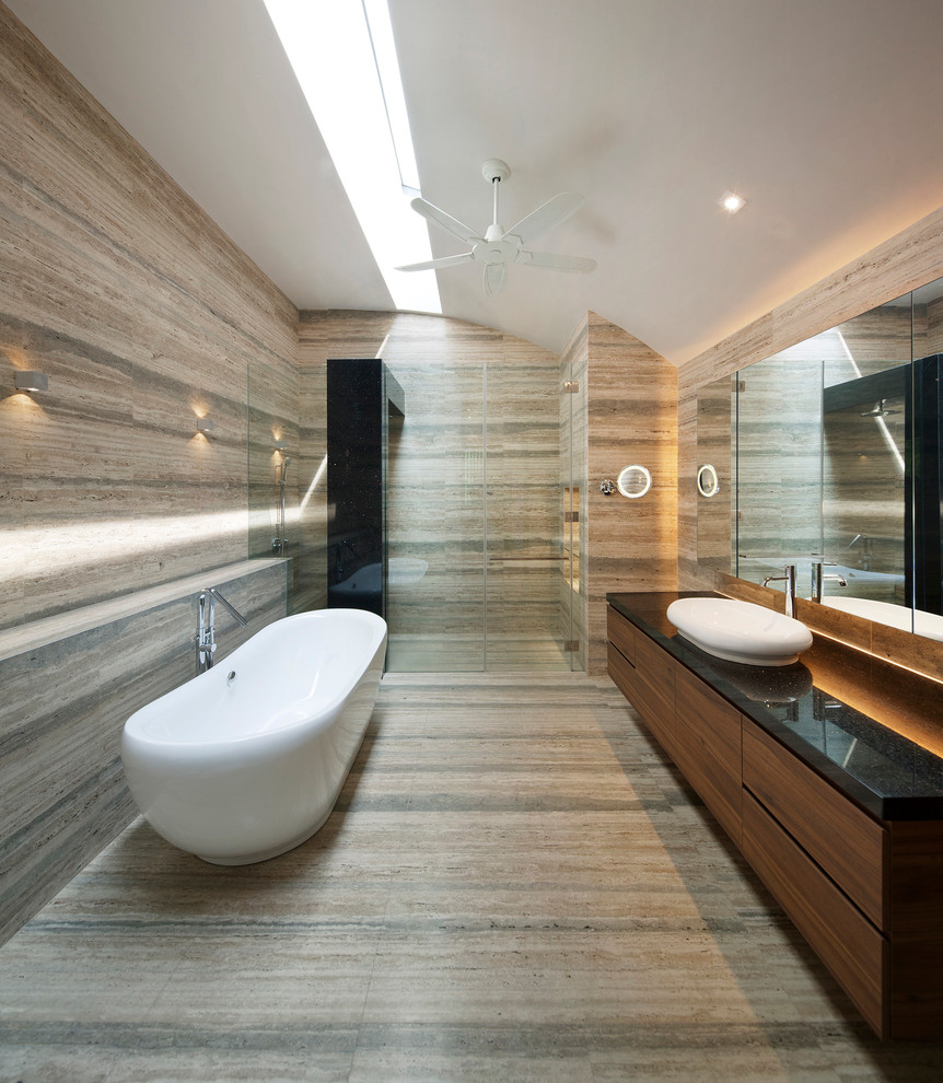 Inspiration for a contemporary bathroom in Singapore with a vessel sink, flat-panel cabinets, dark wood cabinets, a freestanding tub, a curbless shower and beige tile.