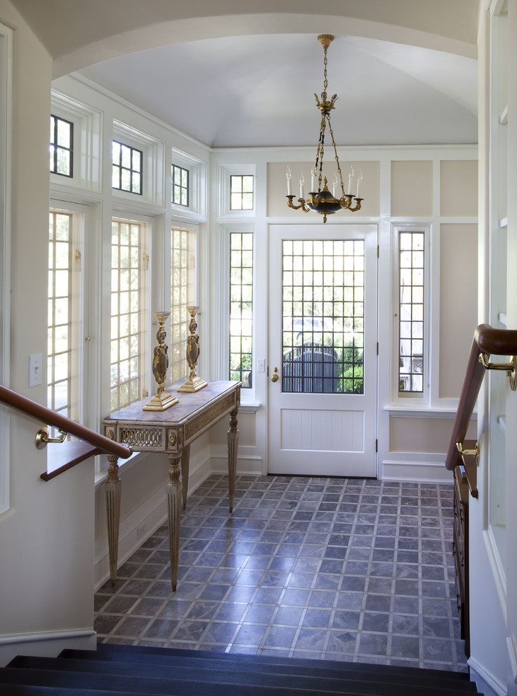 Design ideas for a traditional entryway in New York with ceramic floors.