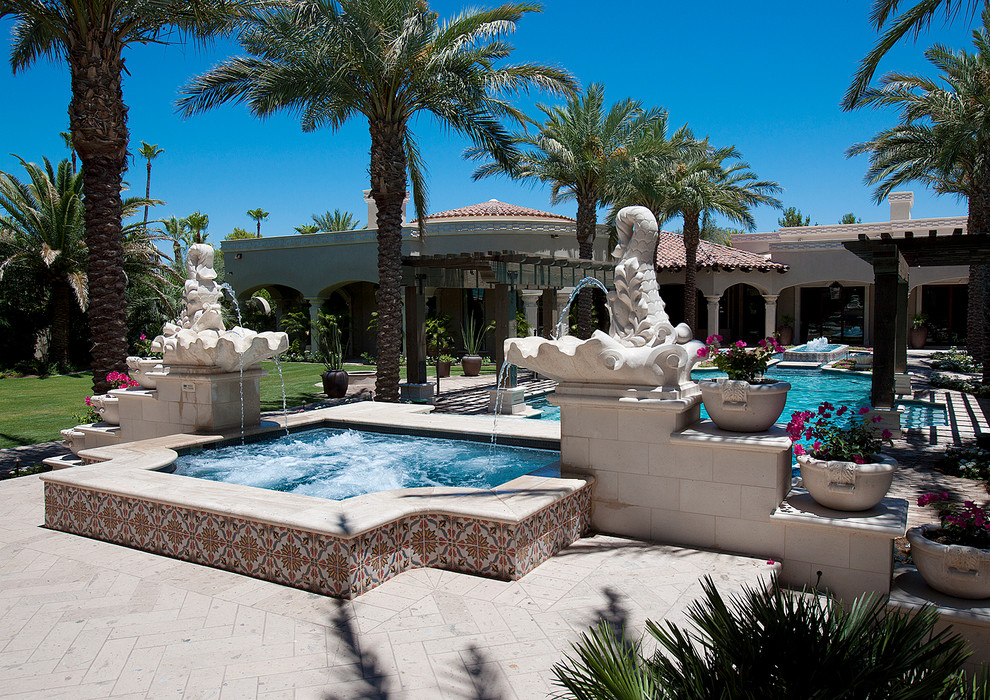 Inspiration for a huge transitional backyard brick and rectangular natural pool fountain remodel in Phoenix