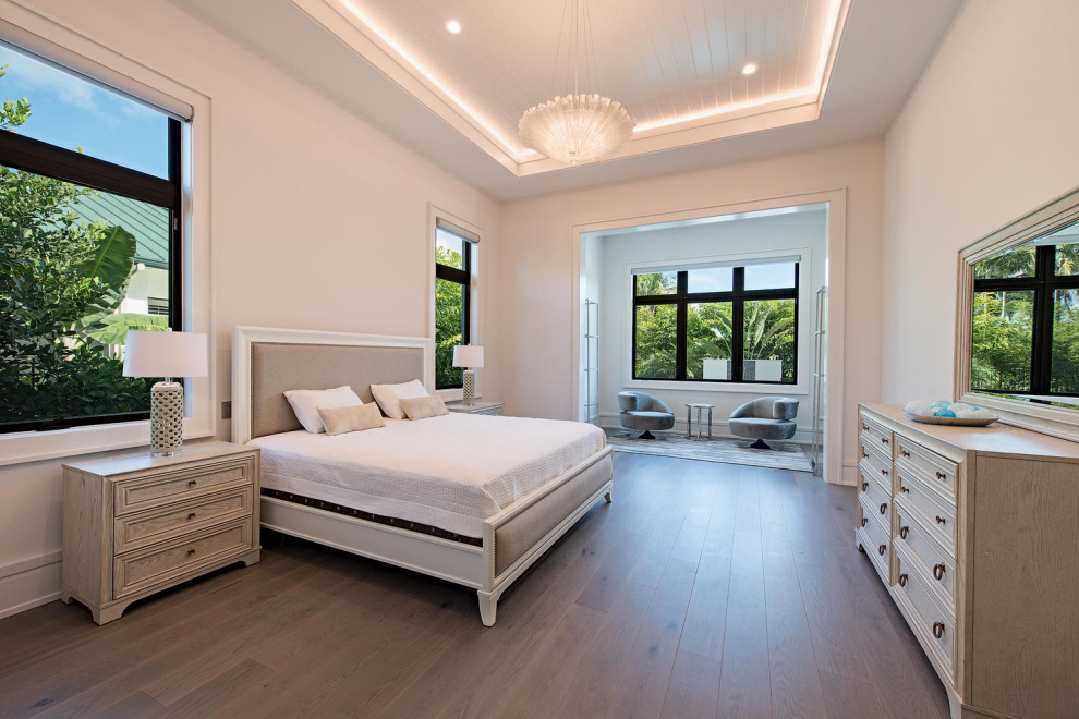 Large modern mezzanine bedroom in Wilmington with beige walls, medium hardwood flooring, brown floors and a timber clad ceiling.