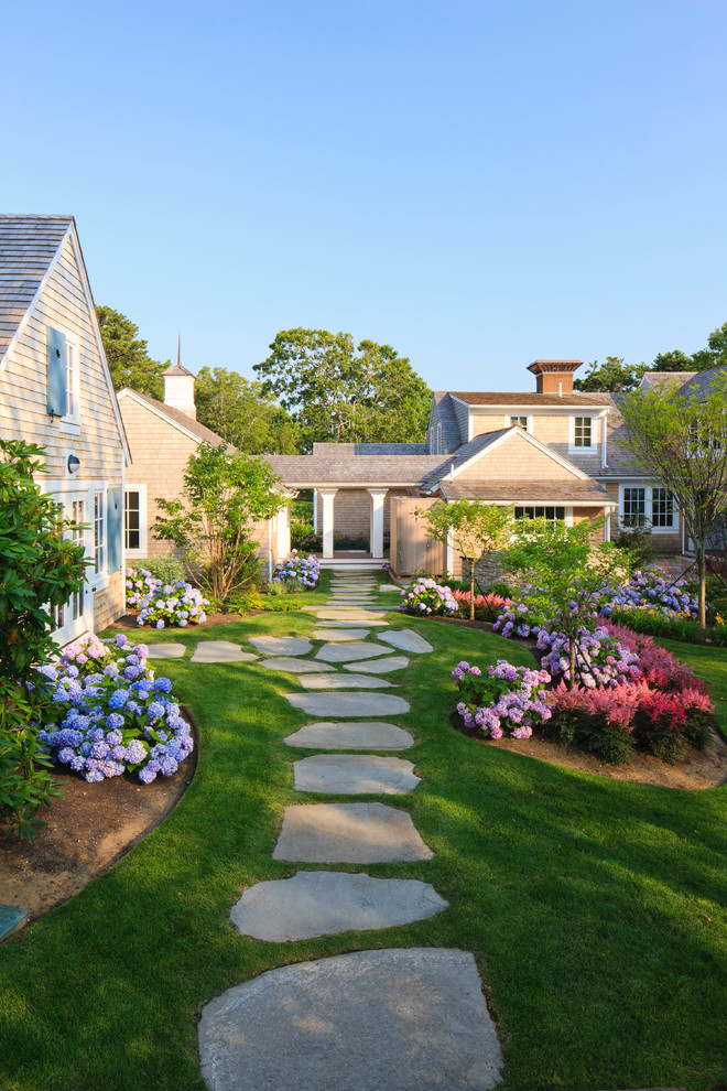 Traditional backyard shaded garden in Boston with natural stone pavers.