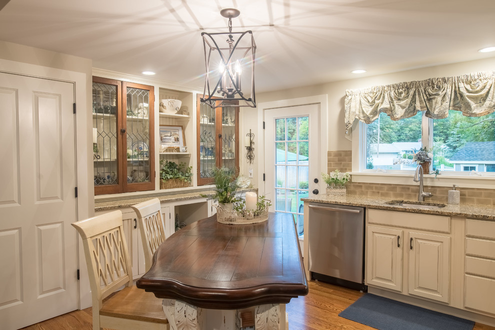 Inspiration for a small traditional l-shaped separate kitchen in Bridgeport with an undermount sink, raised-panel cabinets, white cabinets, granite benchtops, beige splashback, subway tile splashback, stainless steel appliances, medium hardwood floors, with island and brown floor.