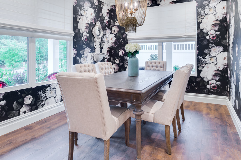 Example of a mid-sized transitional medium tone wood floor and brown floor enclosed dining room design in Orange County with multicolored walls and no fireplace