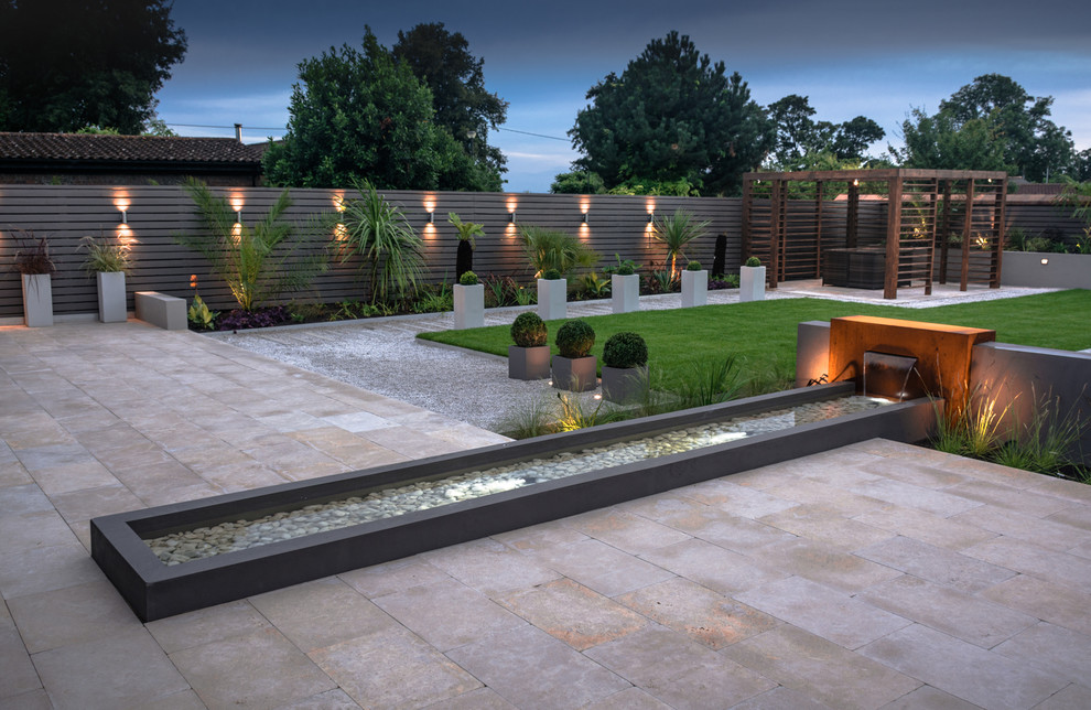 This is an example of a mid-sized contemporary garden in Cheshire.