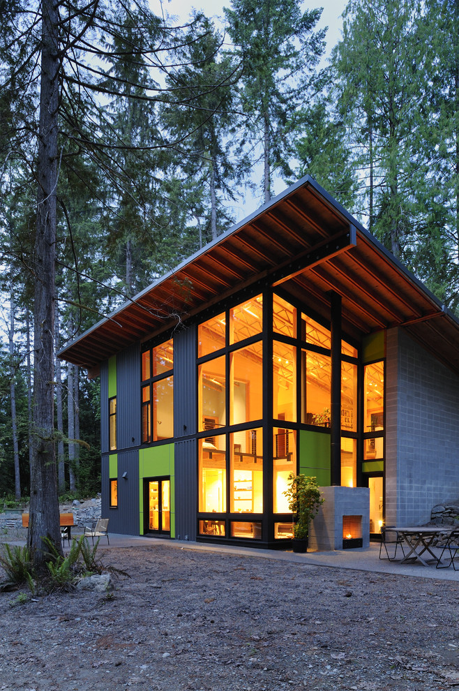 Large contemporary two-storey multi-coloured exterior in Seattle with a shed roof and mixed siding.