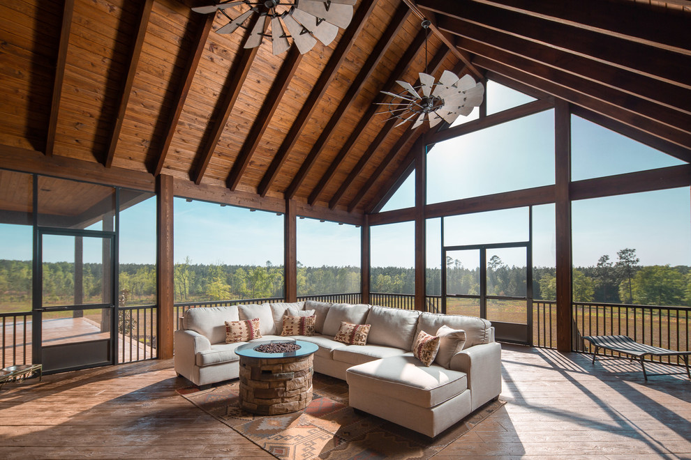 Inspiration for a large country sunroom in Atlanta with concrete floors and brown floor.