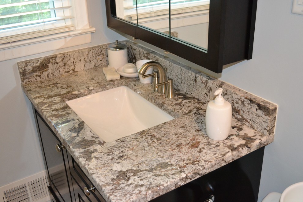 Example of a mid-sized transitional 3/4 bathroom design in Atlanta with beaded inset cabinets, dark wood cabinets, gray walls, an undermount sink, granite countertops and multicolored countertops