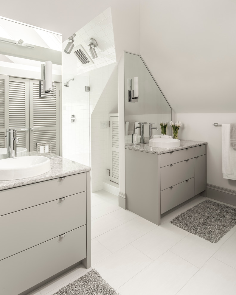 Inspiration for a mid-sized contemporary master bathroom in Minneapolis with flat-panel cabinets, beige cabinets, a curbless shower, a one-piece toilet, white tile, porcelain tile, beige walls, marble floors, a vessel sink and marble benchtops.