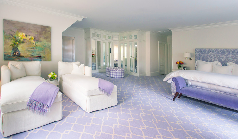 Expansive transitional master bedroom in Boston with beige walls, carpet and purple floor.