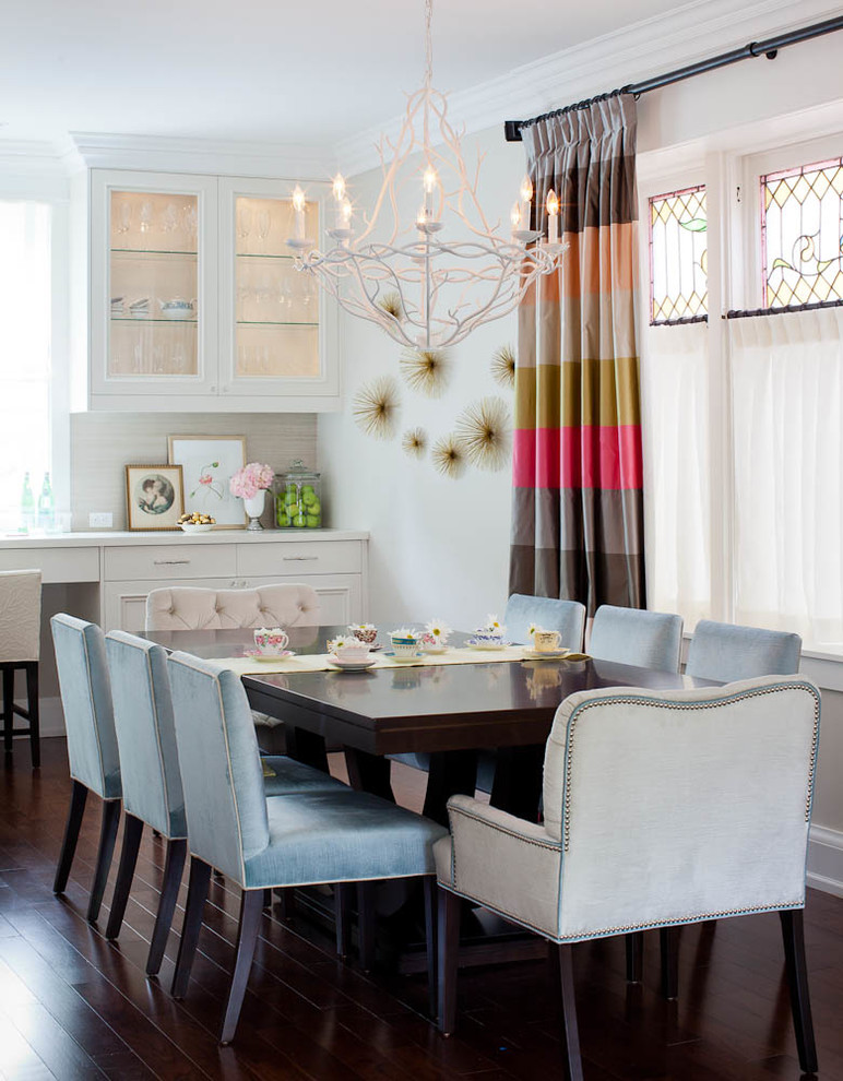 Photo of a transitional dining room in Toronto with beige walls and dark hardwood floors.