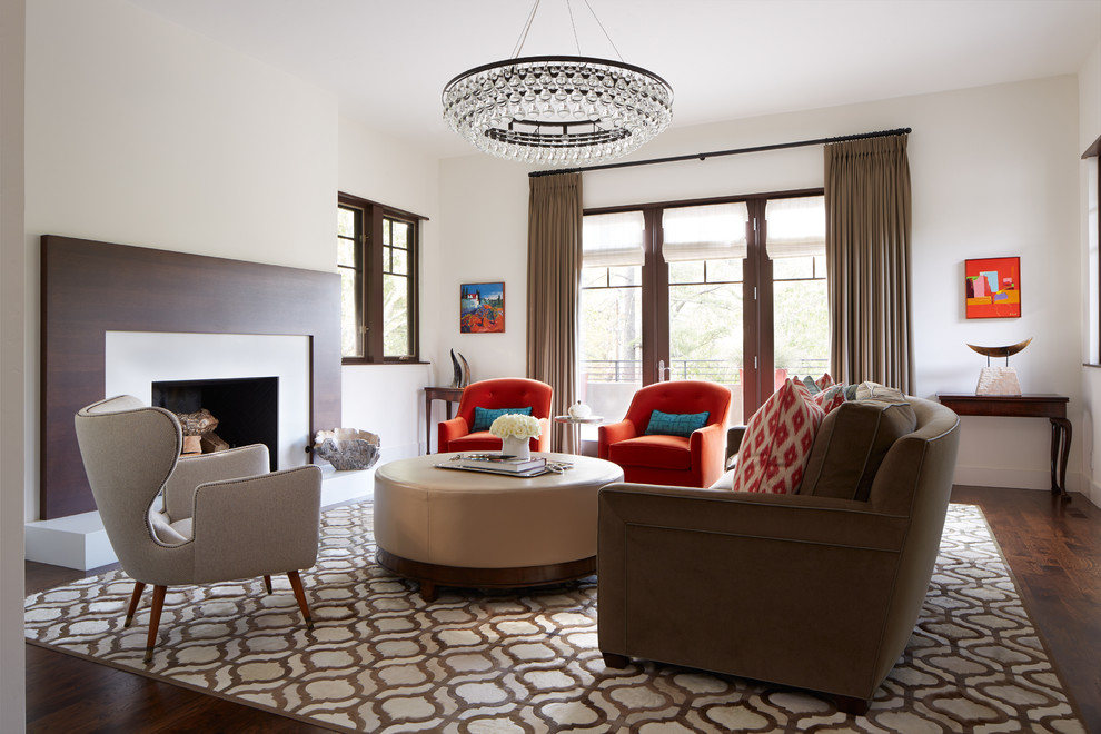 Mid-sized trendy formal and enclosed carpeted living room photo in San Francisco with white walls, a standard fireplace, no tv and a wood fireplace surround