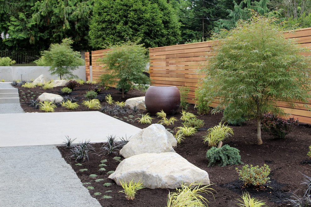 Photo of a modern partial sun side yard landscaping in Seattle.