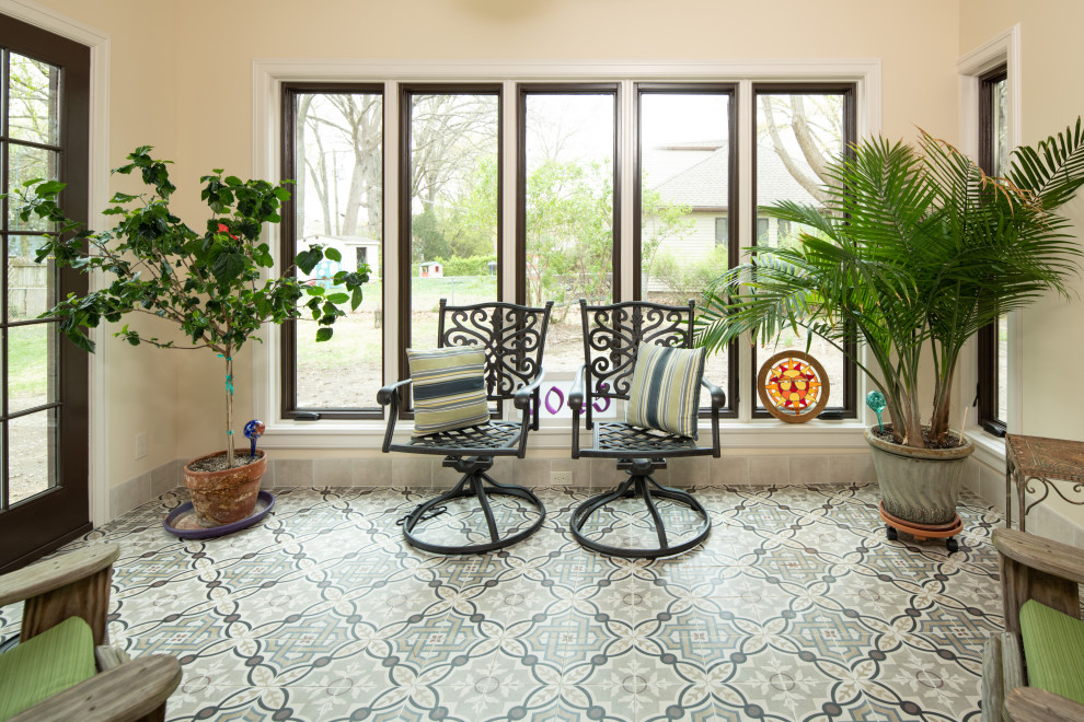 Inspiration for a traditional sunroom in Kansas City with porcelain floors.