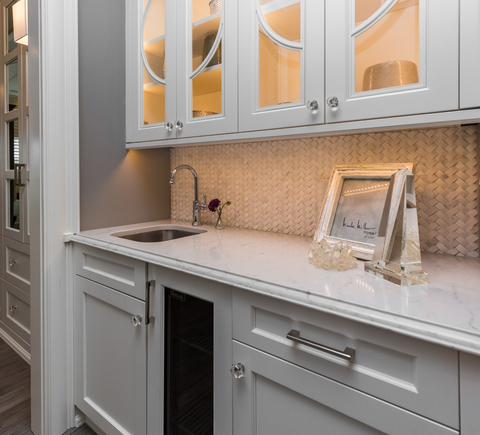 Example of a mid-sized transitional painted wood floor eat-in kitchen design with a drop-in sink, recessed-panel cabinets, white cabinets, marble countertops, white backsplash and stainless steel appliances