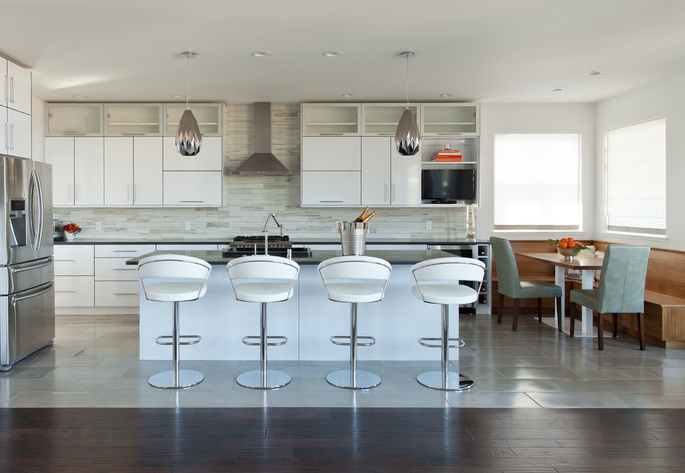 Photo of a mid-sized modern single-wall eat-in kitchen in Other with quartz benchtops and with island.