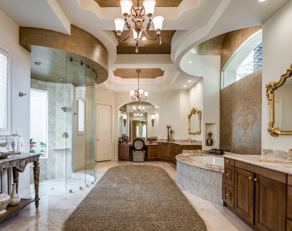 This is an example of a large traditional master bathroom in Other with raised-panel cabinets, medium wood cabinets, an undermount tub, a curbless shower, white walls, an undermount sink, beige floor, an open shower and beige benchtops.