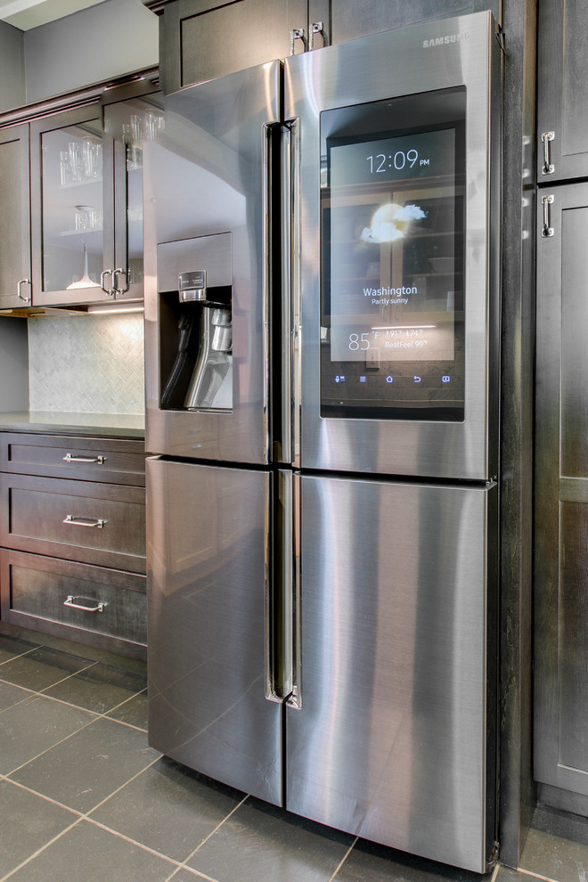 Inspiration for a mid-sized transitional home design remodel in DC Metro with recessed-panel cabinets, quartz countertops, stainless steel appliances and a peninsula