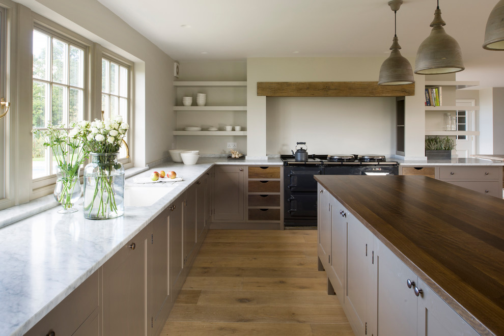 Photo of a transitional kitchen in Sussex.