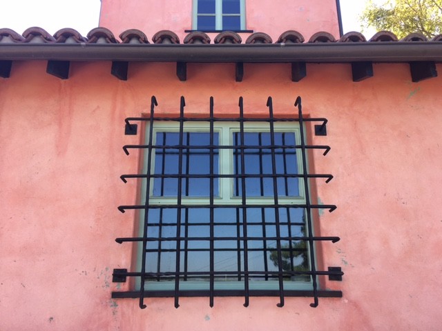 Inspiration for a mediterranean two-storey stucco house exterior in Los Angeles with a gable roof and a tile roof.